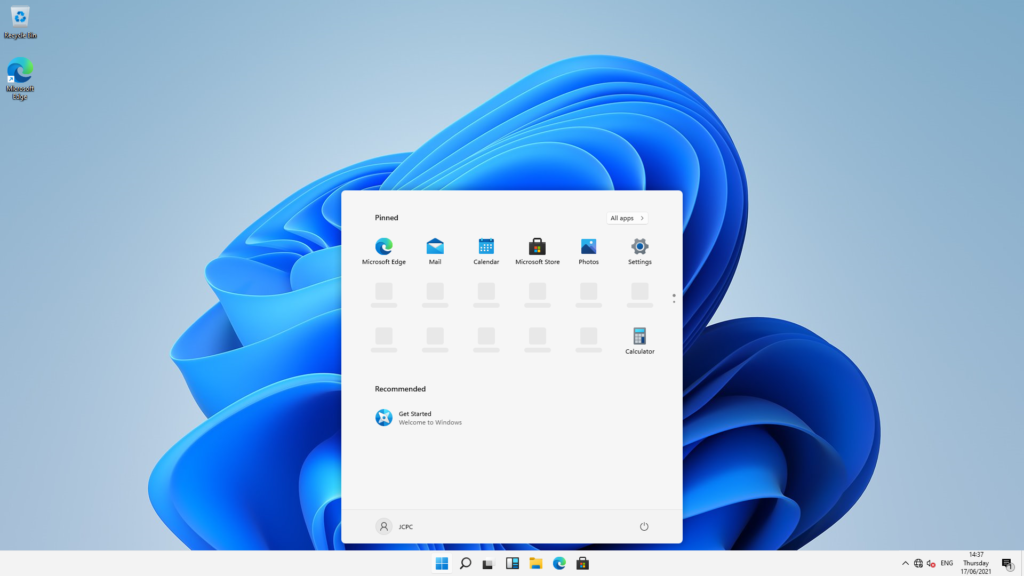 Task bar and start menu has been made central. Desktop screen and blue background